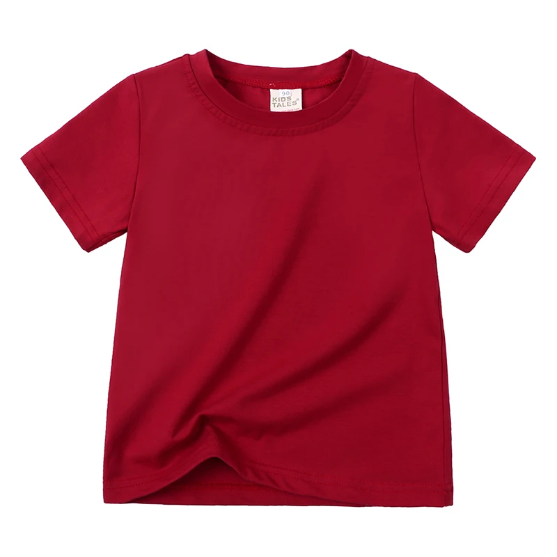 Child wearing a white unisex short sleeve cotton blend t-shirt, casual summer style