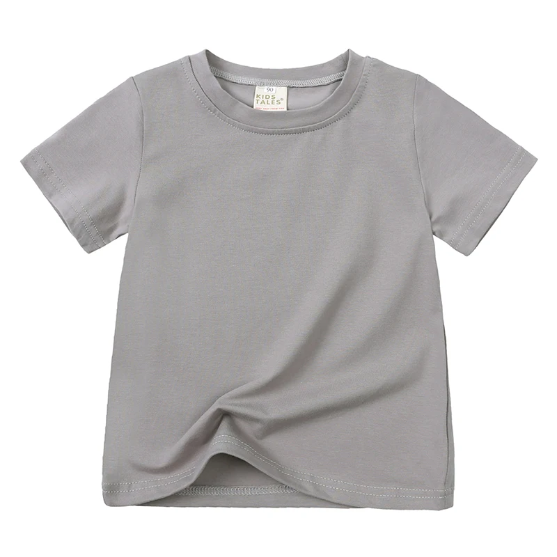 Close-up of kids' unisex short sleeve t-shirt fabric, showing soft cotton texture