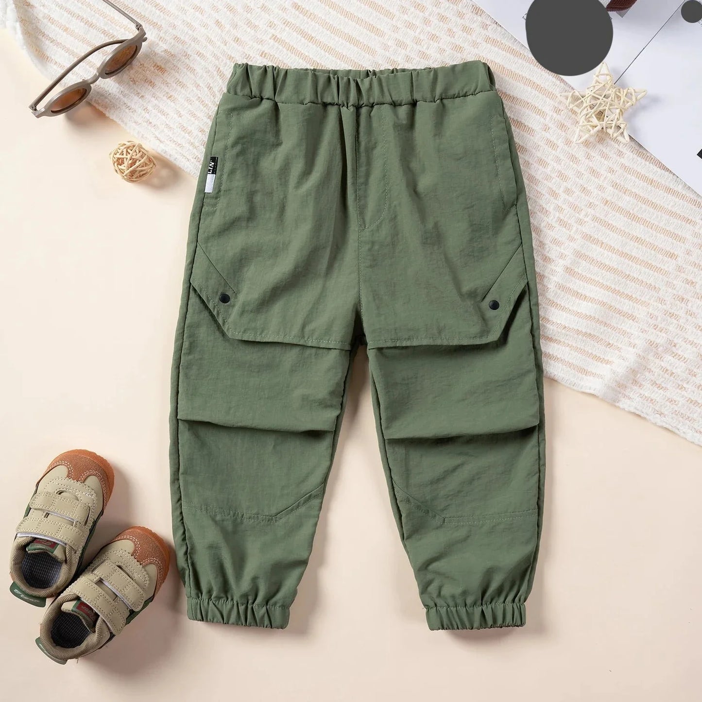 Front view of kids ankle length nylon cargo overalls, practical for play