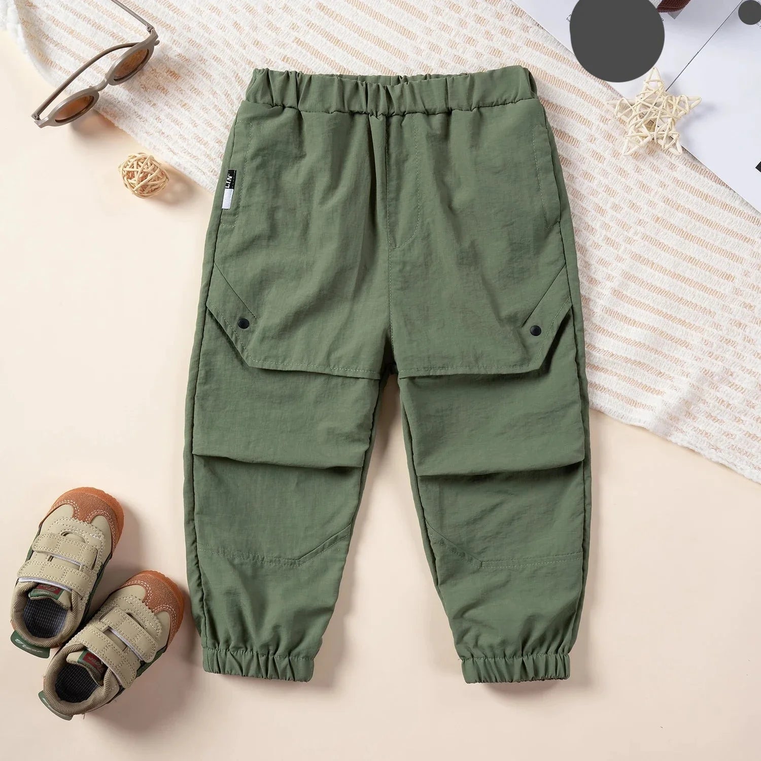 Front view of kids ankle length nylon cargo overalls, practical for play