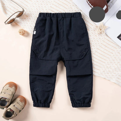 Back view of childrens unisex loose fit cargo overalls, spring playwear