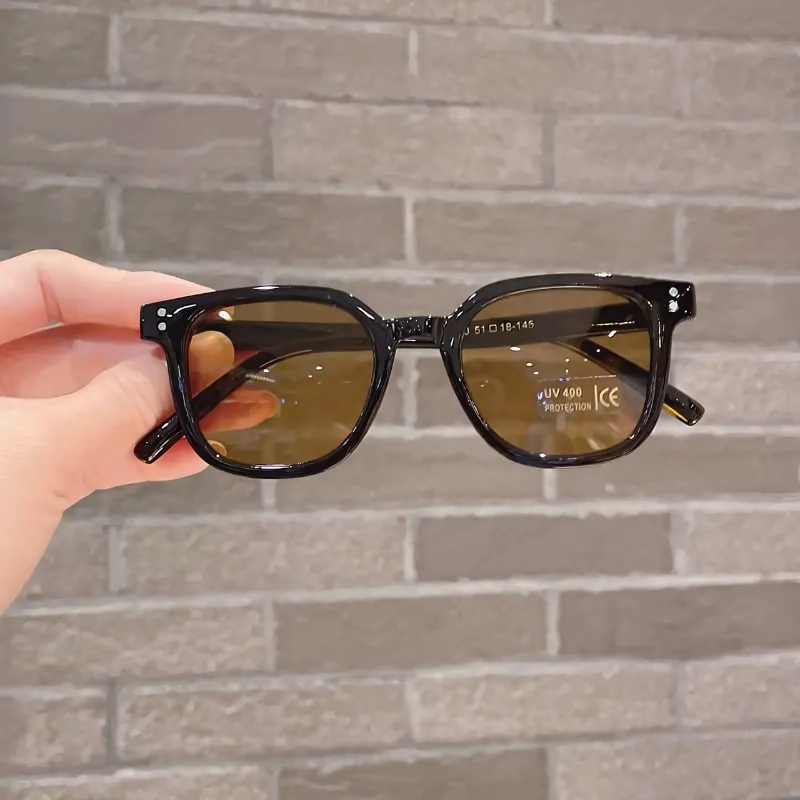 Girl modeling vintage square UV400 sunglasses, perfect for sun protection and a trendy look