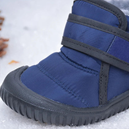 Childrens' yellow winter boots, anti-slip and warm, with secure hook and loop.