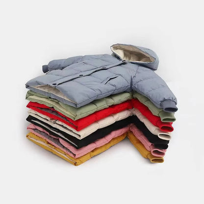 Toddler wearing a vibrant red warm cotton puffer jacket, ideal for winter outdoor play