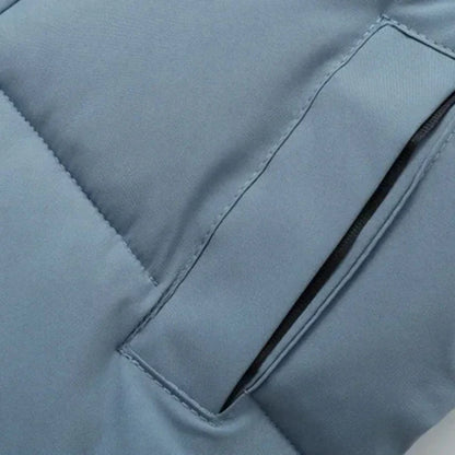 Back of a navy blue children's warm cotton puffer jacket, featuring a protective hood