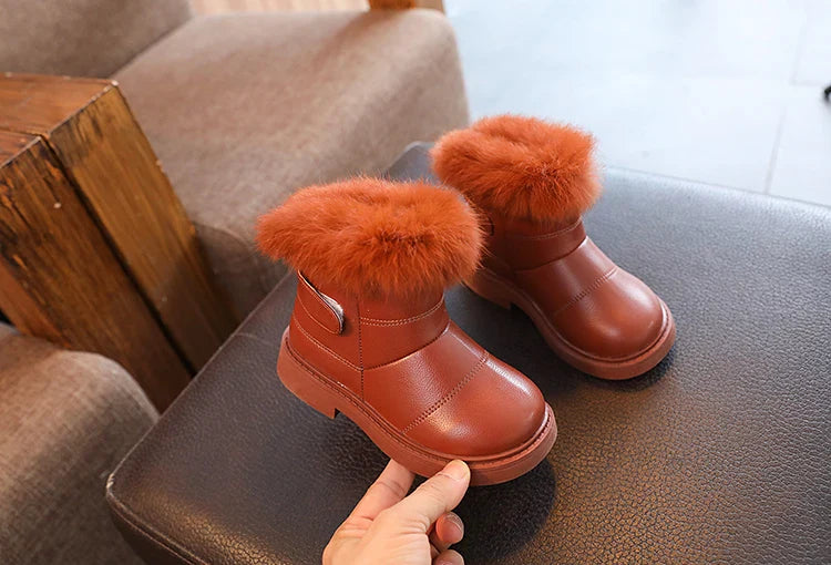 Plush-lined blue kids' snow boots, providing warmth and waterproofing for winter