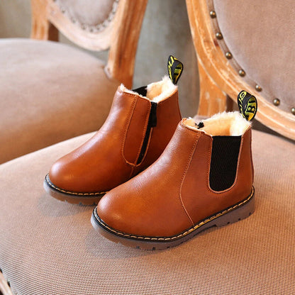 Kids' waterproof winter Chelsea boots, black, with side zipper. Perfect for cold, wet weather.