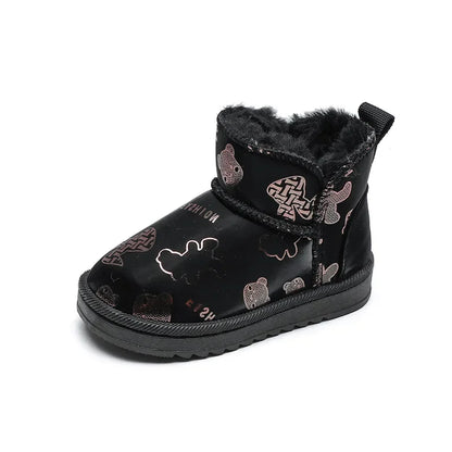 Close-up of waterproof winter snow boots for kids, showing anti-slip sole and warm interior