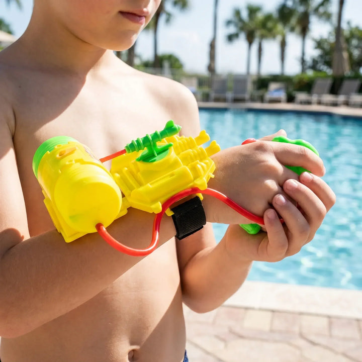 Children's hands-free wrist water gun for beach and pool play.