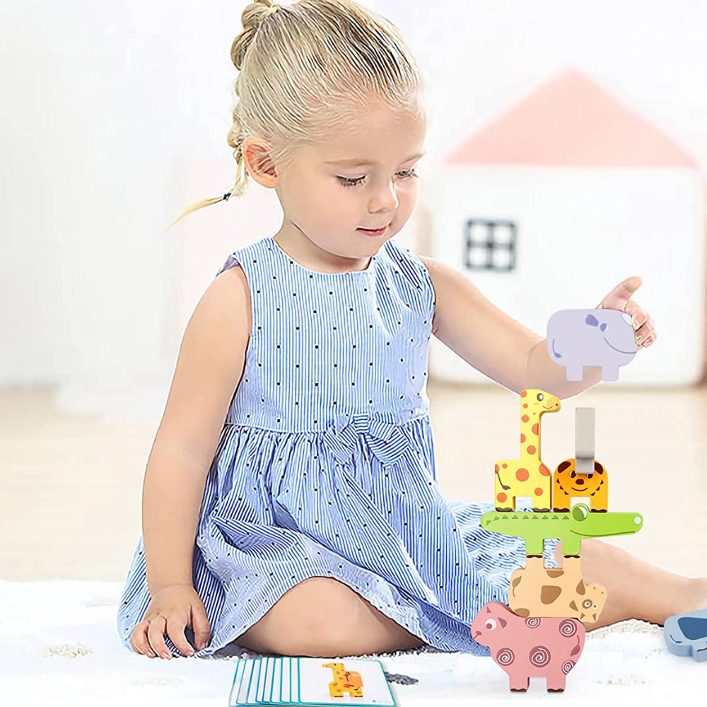 Child playing with wooden animal stacking game, an educational sorting toy for kids