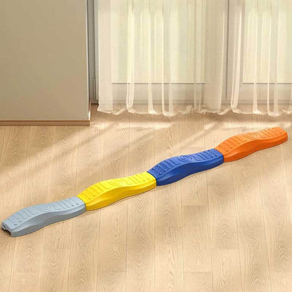 Brightly colored balance beam pieces arranged creatively for active and imaginative play