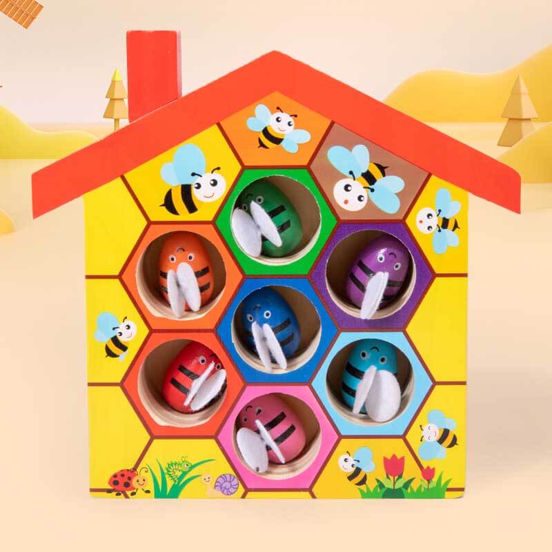 Fine motor skills activity toy: child playing with Beehive Tweezer Game