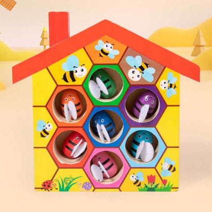 Fine motor skills activity toy: child playing with Beehive Tweezer Game