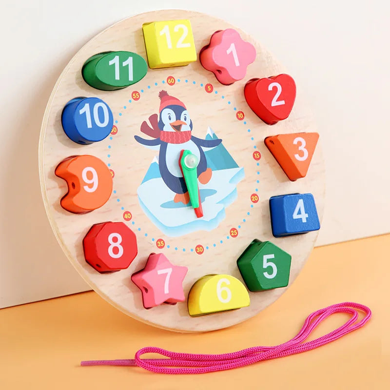 Close-up of a child's hand moving hands on a wooden learning clock, teaching tell time