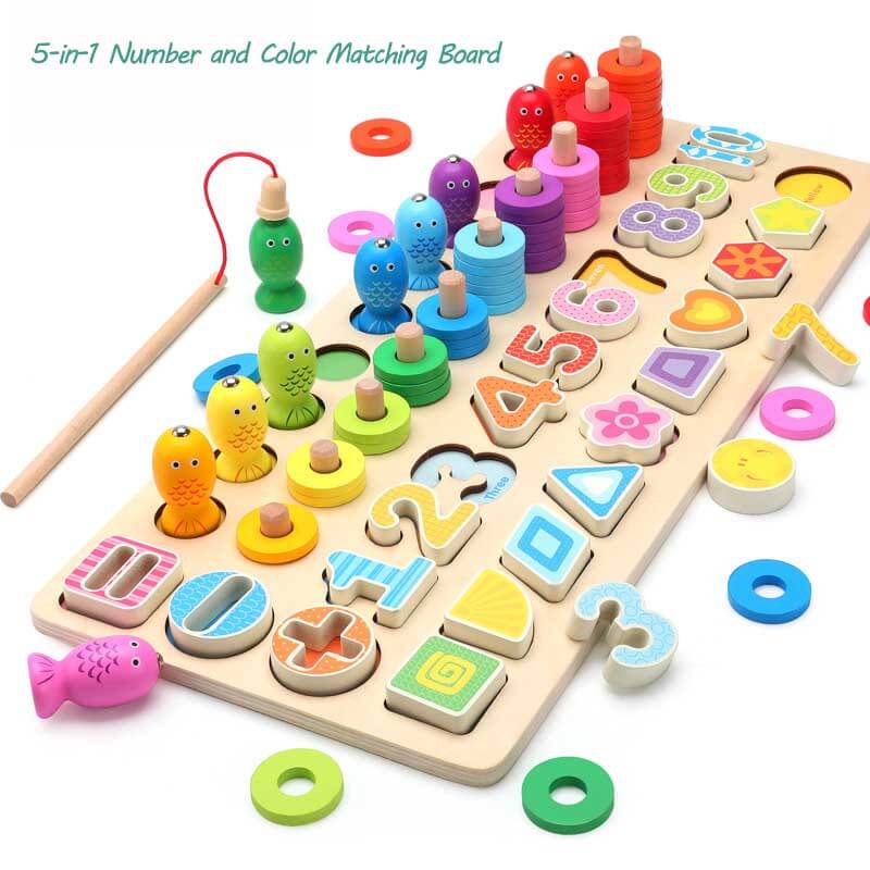 Close-up of magnetic numbers and letters on wooden fish, part of an educational fishing game for kids