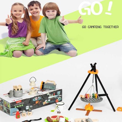 Toddler playing with wooden pretend play picnic set, includes basket and play food