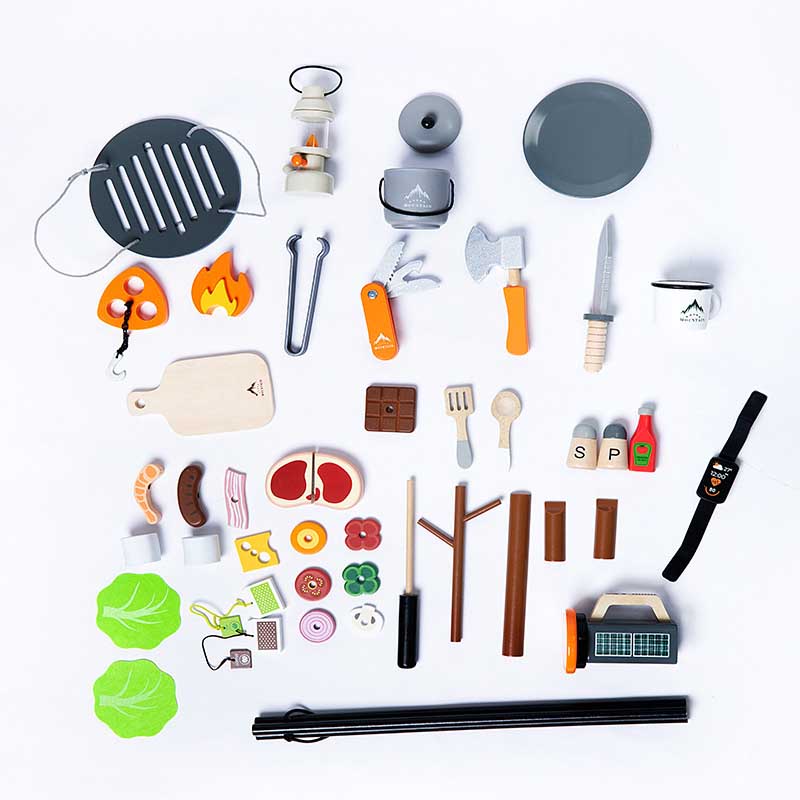 Close-up of wooden pretend play picnic set food: sandwiches, fruits, and desserts