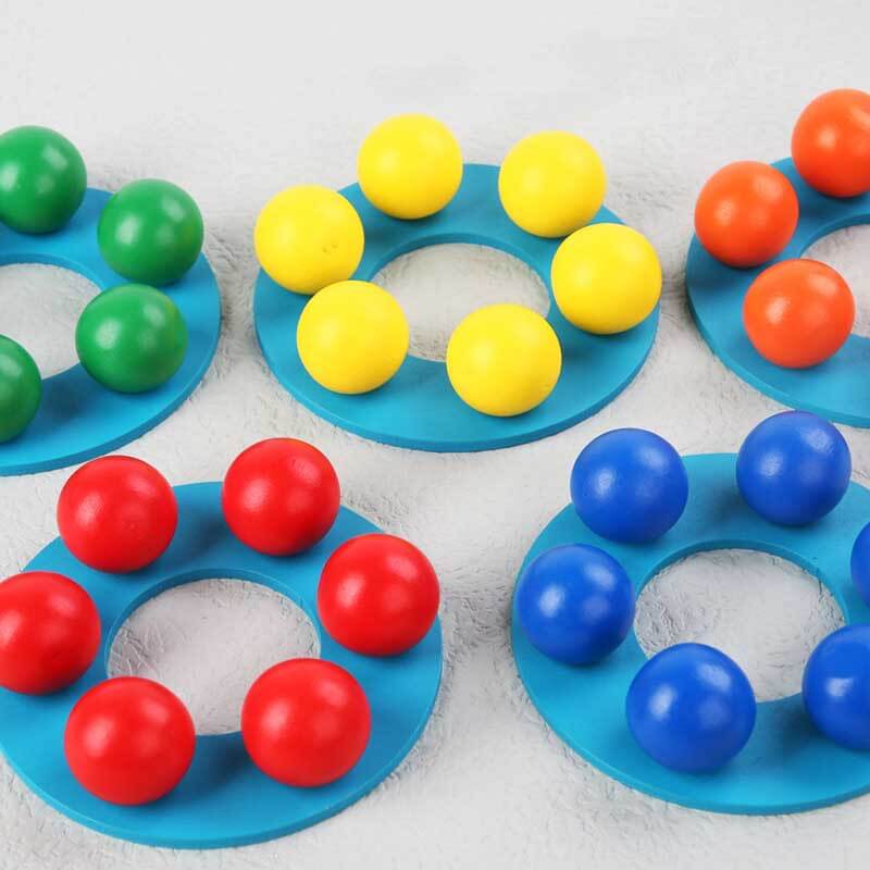 Preschool kids playing with vibrant wooden rainbow stacking toy tower