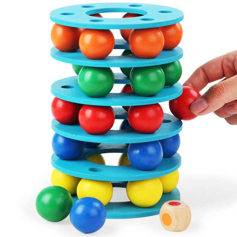 Close-up of kids colorful wooden rainbow stacking balls tower toy