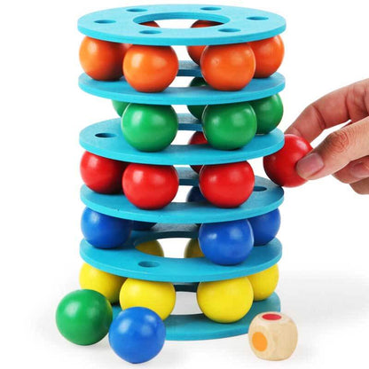Close-up of kids colorful wooden rainbow stacking balls tower toy