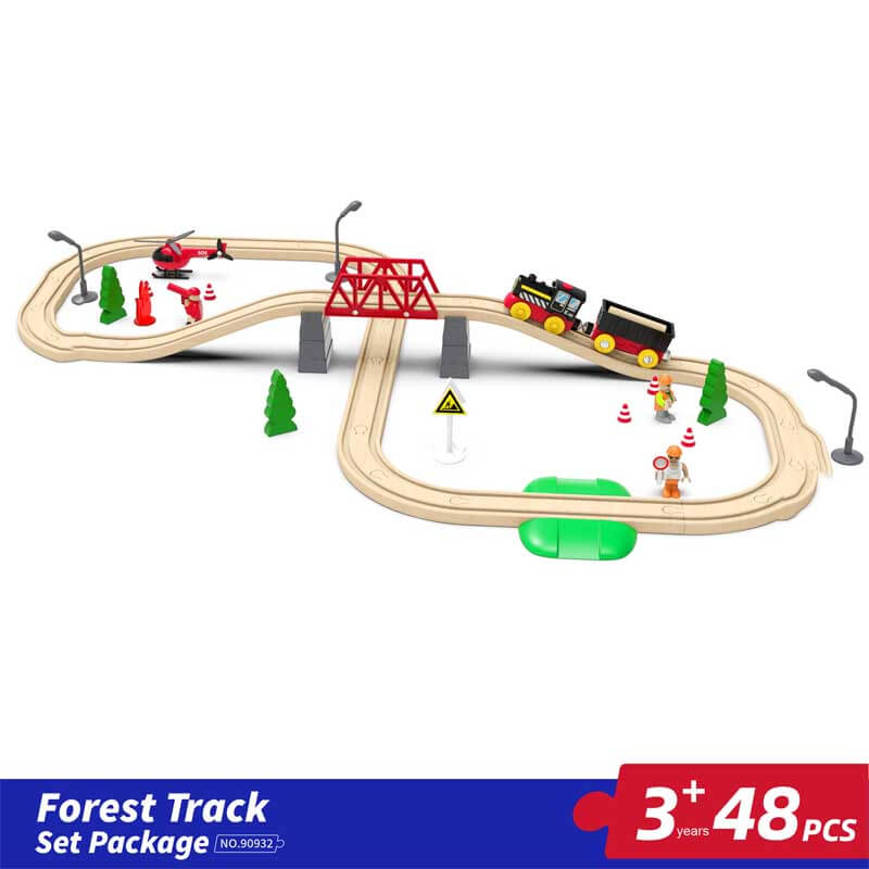 Child playing with a large wooden train set, battery engine moving on the tracks playfully