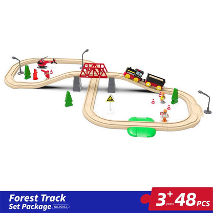 Child playing with a large wooden train set, battery engine moving on the tracks playfully