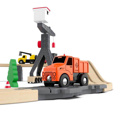 Top-down view of an assembled kids wooden train set featuring a battery-powered engine