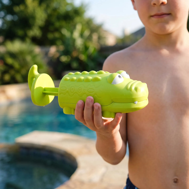 Green frog water squirter for kids' pool parties & bath time; fun outdoor play toy.