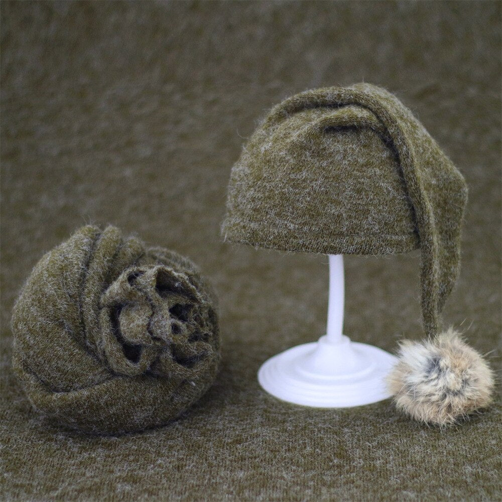 Baby shower gift: hand-knitted baby swaddle and fur ball hat set for infants.