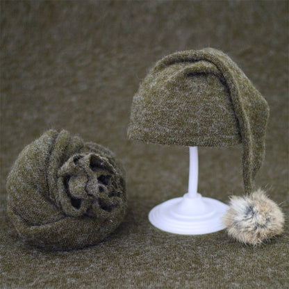 Baby shower gift: hand-knitted baby swaddle and fur ball hat set for infants.