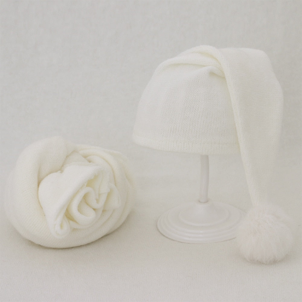 Soft baby blanket & fur ball hat set, gentle comfort for newborn photography.