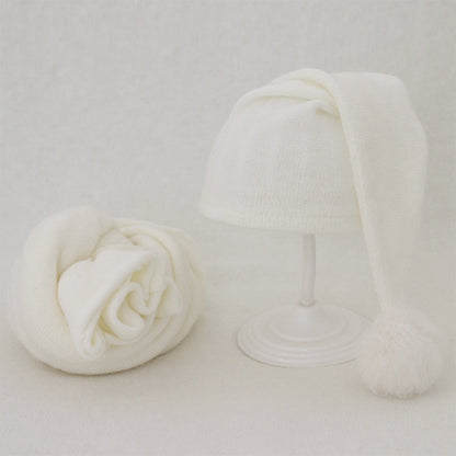 Soft baby blanket & fur ball hat set, gentle comfort for newborn photography.