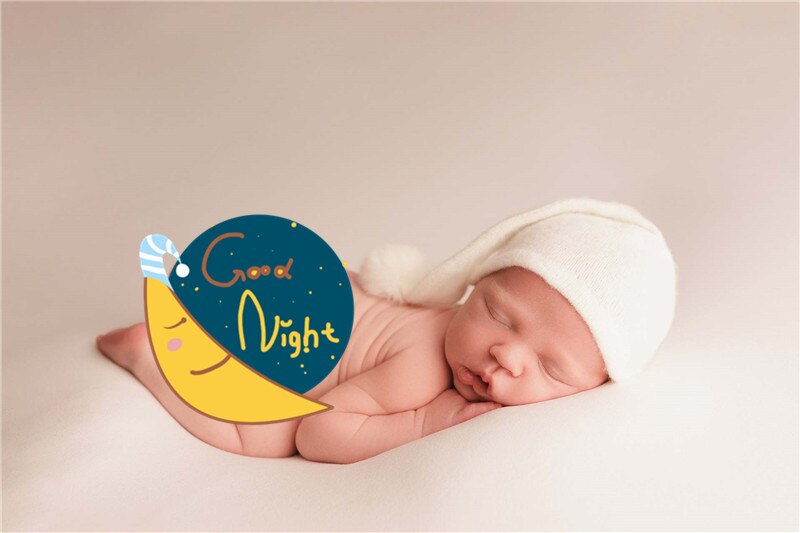 Elegant beige knitted baby swaddle wrap & matching fur ball hat for photos.