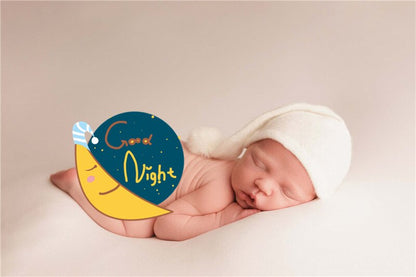 Elegant beige knitted baby swaddle wrap & matching fur ball hat for photos.