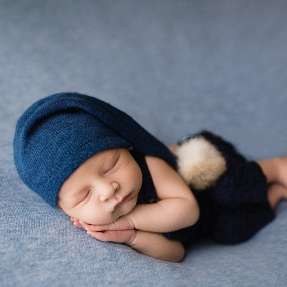 Baby comfort set: knitted infant swaddle blanket & fur ball hat for photoshoots.