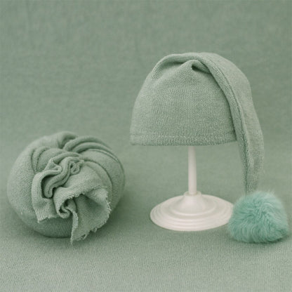 Newborn photography prop: beige knitted swaddle blanket & fur ball beanie for baby.