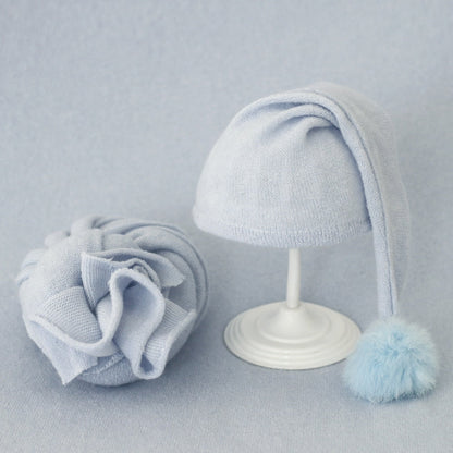 Infant swaddle wrap & fur ball hat set, soft & comfortable baby photoshoot attire.