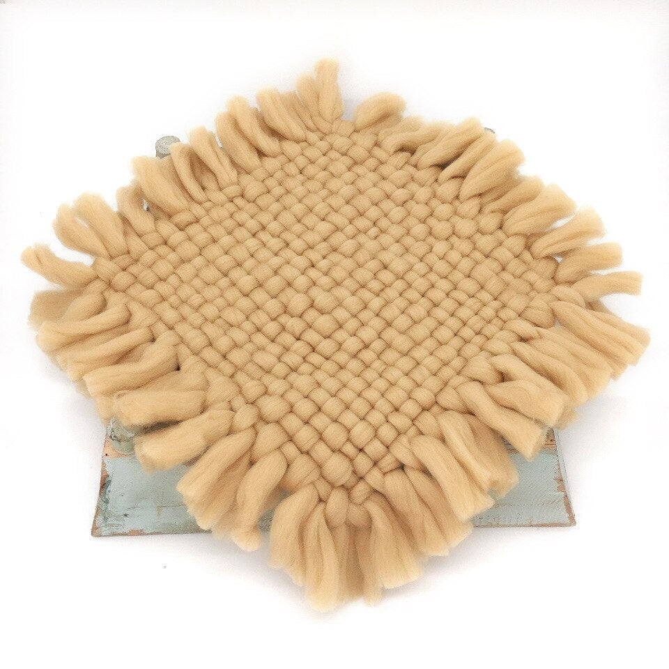 Close-up of textured knitted baby blanket, ideal newborn photography prop for infants