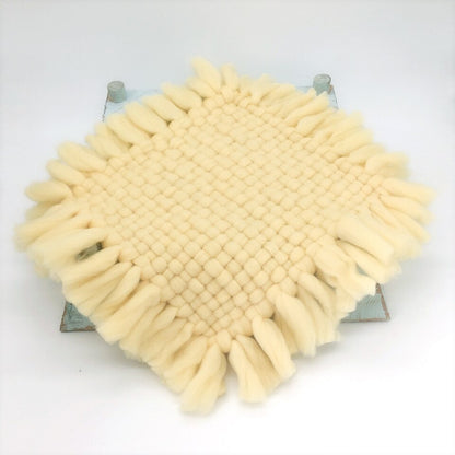 Handmade knitted baby blanket in a gentle pastel color, excellent newborn photography prop