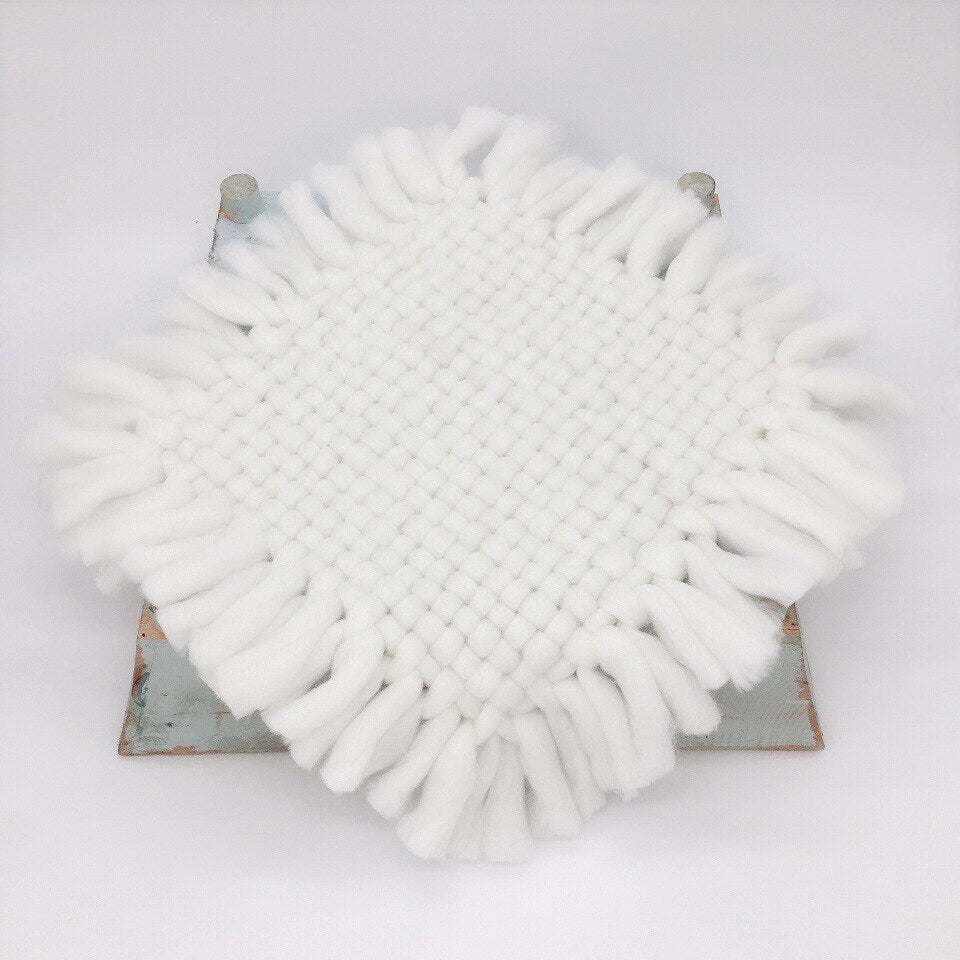 Knitted baby blanket in blue, a soothing newborn photography prop for baby boy photo shoots
