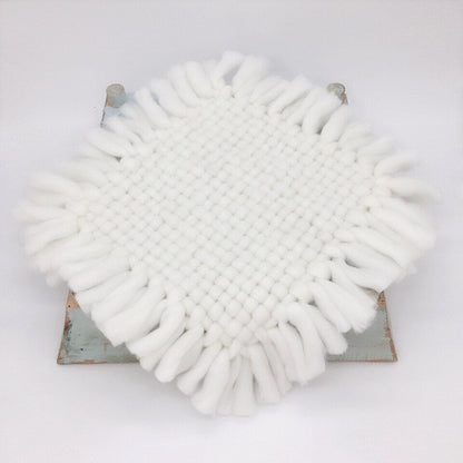 Knitted baby blanket in blue, a soothing newborn photography prop for baby boy photo shoots