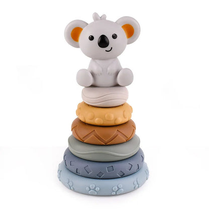 Toddler playing with Koala Cubes stacking teether toy, enhancing fine motor skills and early learning