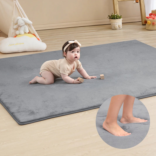 Large memory foam baby play mat, thick and non-slip for safe crawling and tummy time.