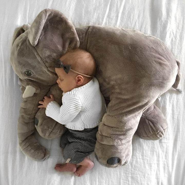 Gray baby elephant pillow, cuddly stuffed animal, essential for nursery, provides comfort & decor