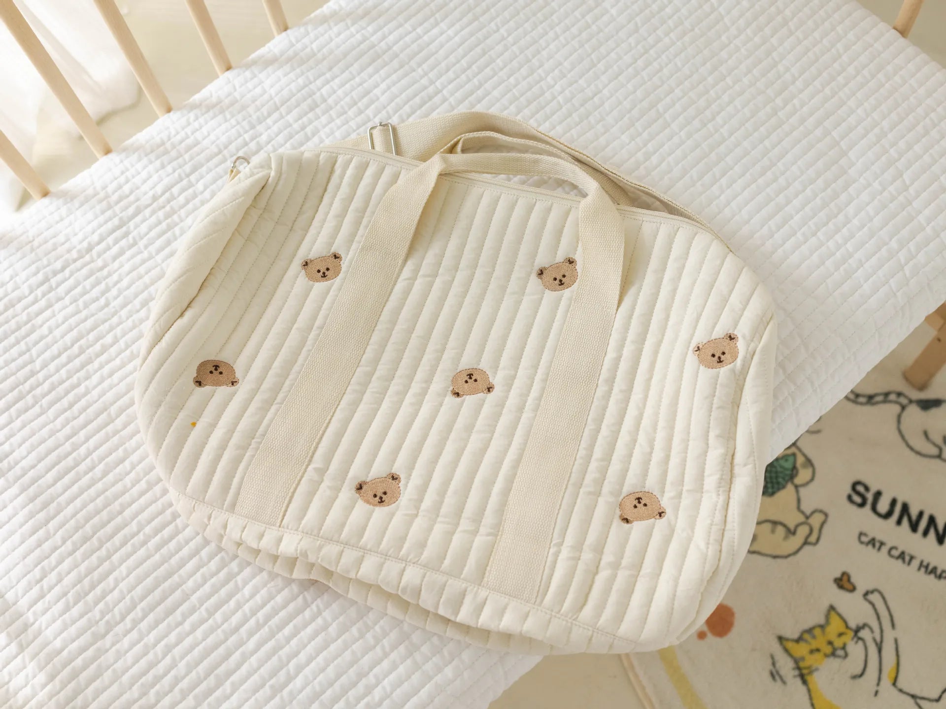 Large quilted diaper bag, floral pattern, includes insulated bottle pocket