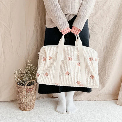 Unisex quilted diaper bag, spacious baby organizer with delicate floral print