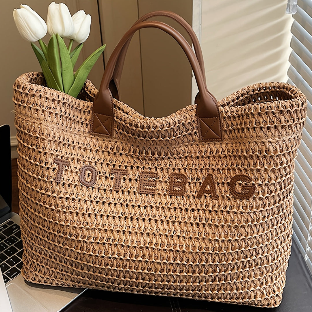 Large woven tote bag with sturdy brown leather handles for women's everyday use.