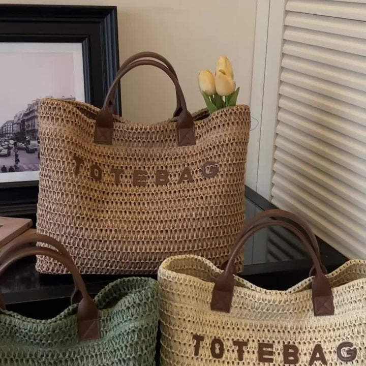 Functional large woven shoulder bag, perfect for carrying essentials with stylish leather handles.