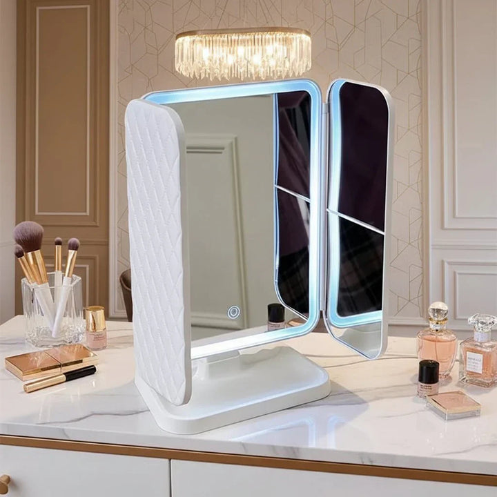 Portable LED makeup mirror with tri-fold panels and 3 adjustable light colors, ideal for any vanity desk.