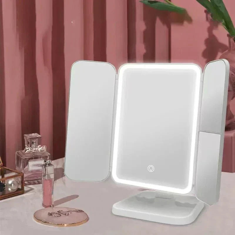 Close-up of a Tri-Fold LED vanity mirror displaying its 3 color light modes for optimal cosmetic clarity.
